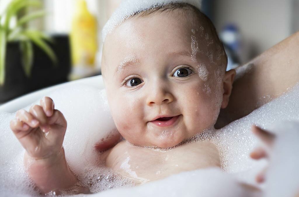 baby bathing in a bathtub