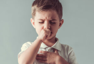 child coughing due to asthma