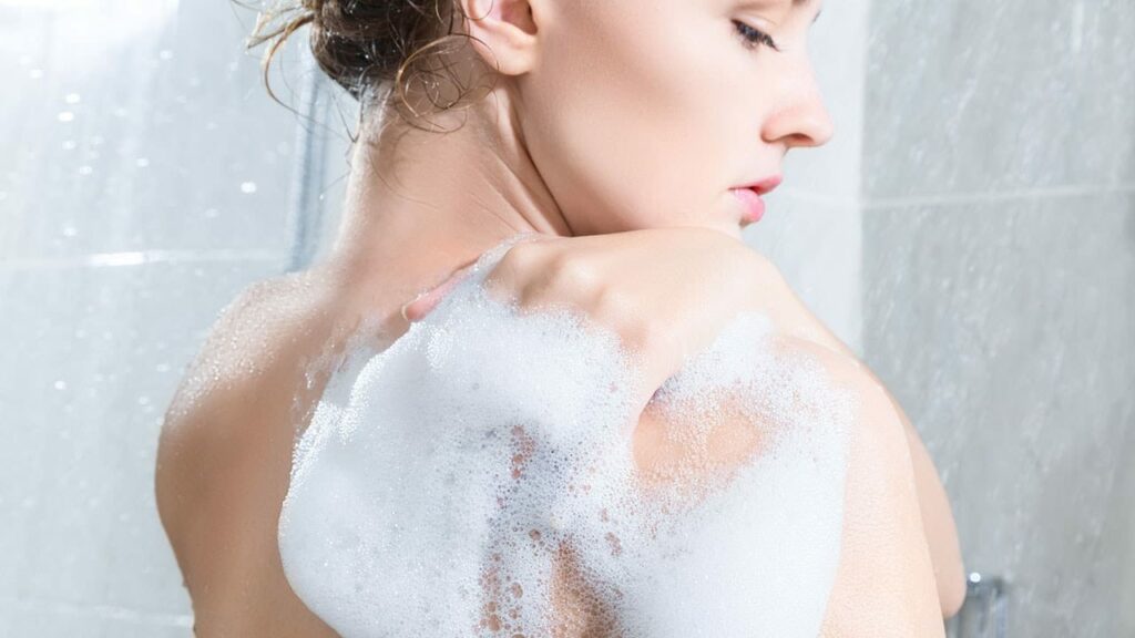 woman using body wash