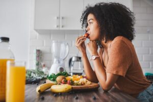 a teen eating healthy snack