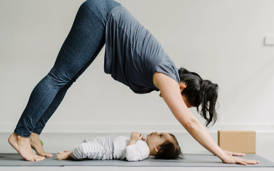 a woman doing exercise in front of her baby after vaginal delivery