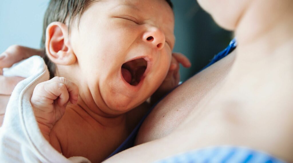 a mother taking care of her baby with cysts