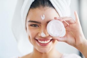 a happy girl holding soap