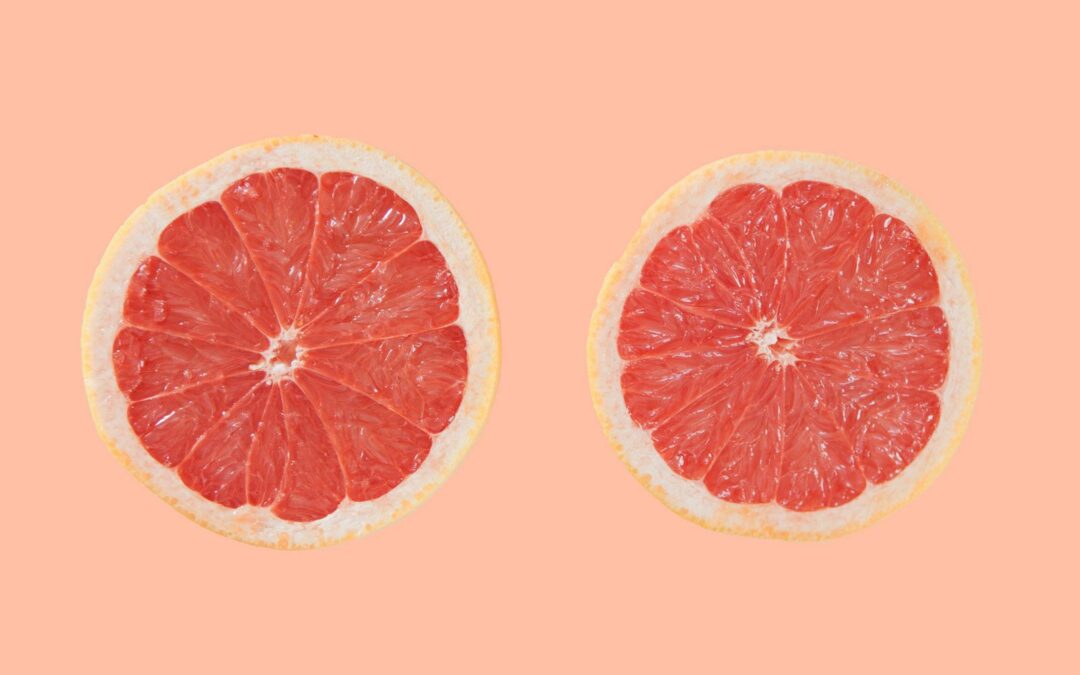 two sliced oranges illustrated as sore boobs