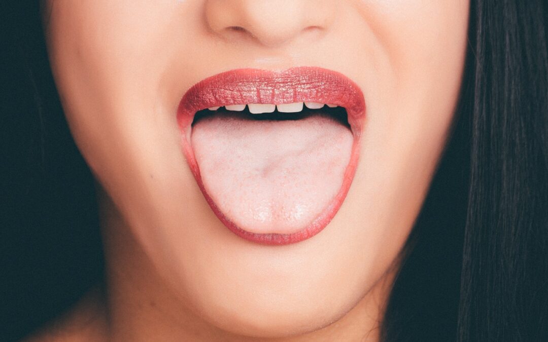 woman with wide open mouth and tongue out